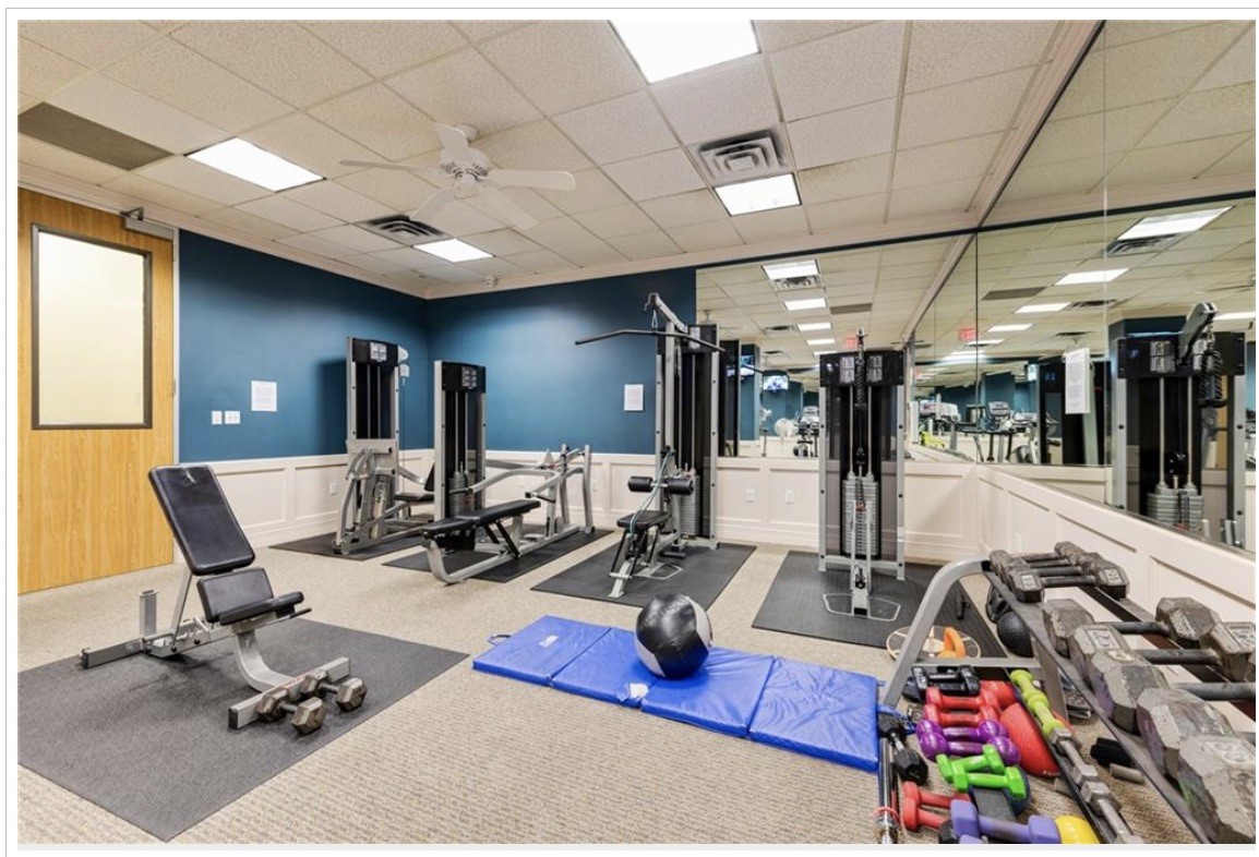 1801 Lavaca Street, Unit 6E Austin, TX 78701 - Photo 27 of 32 a room with gym equipment and a table