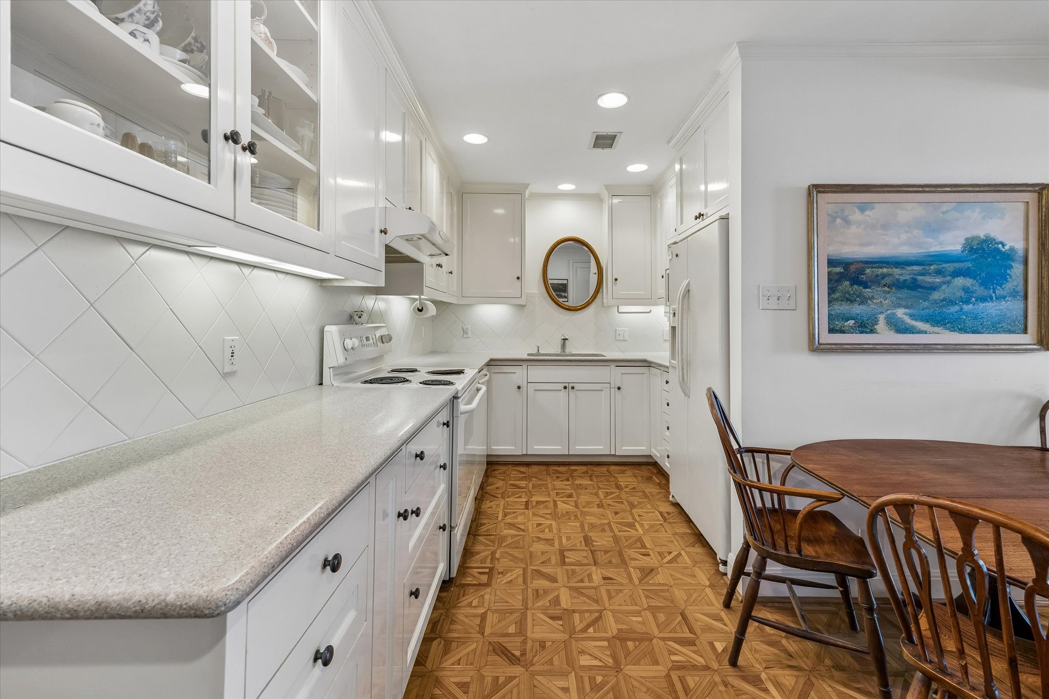 1801 Lavaca Street, Unit 6E Austin, TX 78701 - Photo 5 of 32 a kitchen with cabinets a sink and appliances