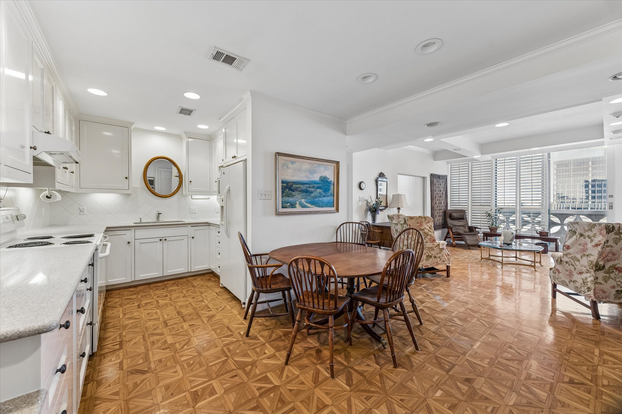 1801 Lavaca Street, Unit 6E Austin, TX 78701 - Photo 9 of 32 a living room with furniture a wooden floor and white cabinets