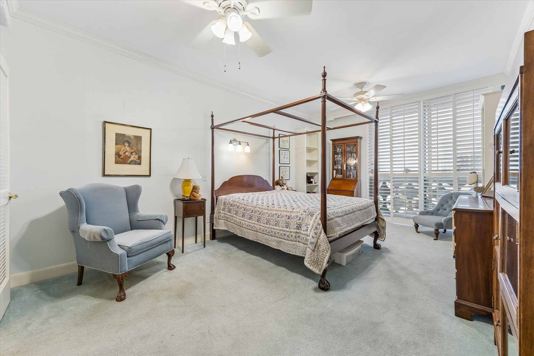 1801 Lavaca Street, Unit 6E Austin, TX 78701 - Photo 10 of 32 a bedroom with a bed and a chandelier