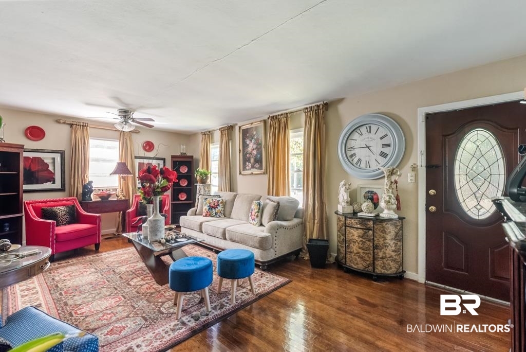 109 Esplanade Avenue Mobile, AL 36606 - Photo 11 of 45 Living area with dark wood-style flooring and ceiling fan