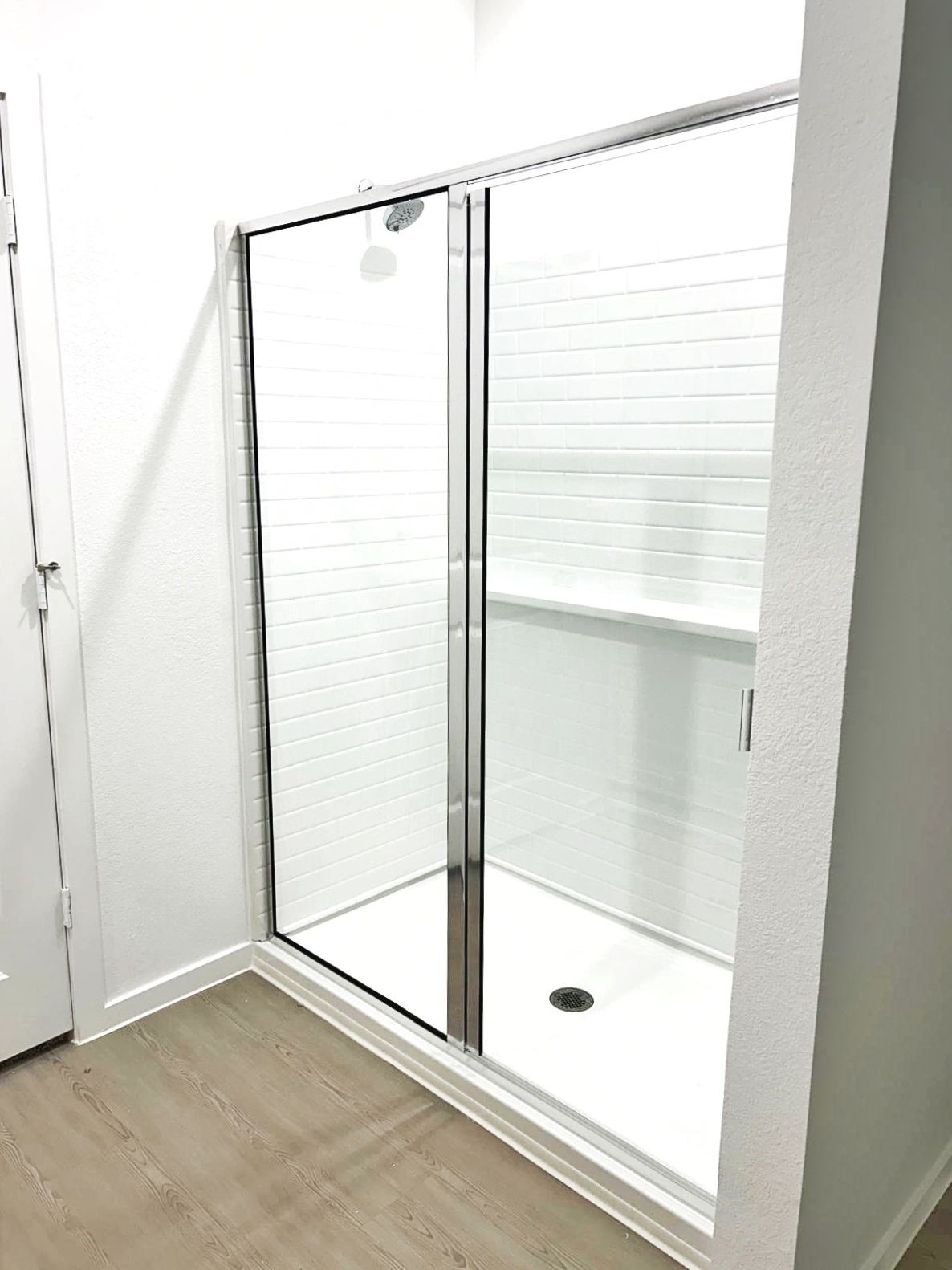 14973 Rustic Moon Road Conroe, TX 77302 - Photo 11 of 22 a bathroom with a glass shower door