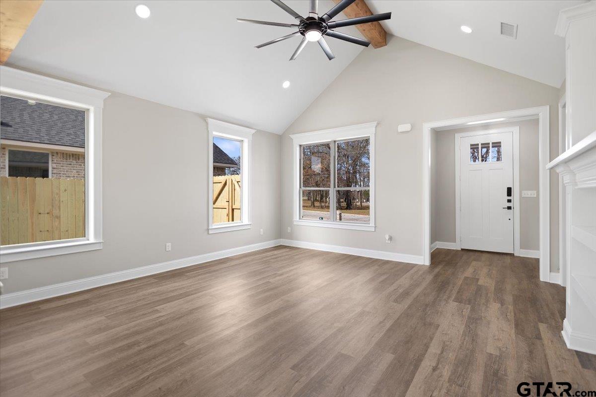 528 West 32nd Street Tyler, TX 75702 - Photo 23 of 29 an empty room with wooden floor closet and windows