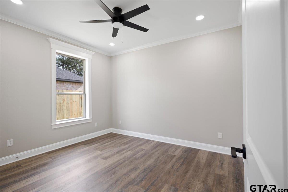 528 West 32nd Street Tyler, TX 75702 - Photo 10 of 29 wooden floor in an empty room with a window
