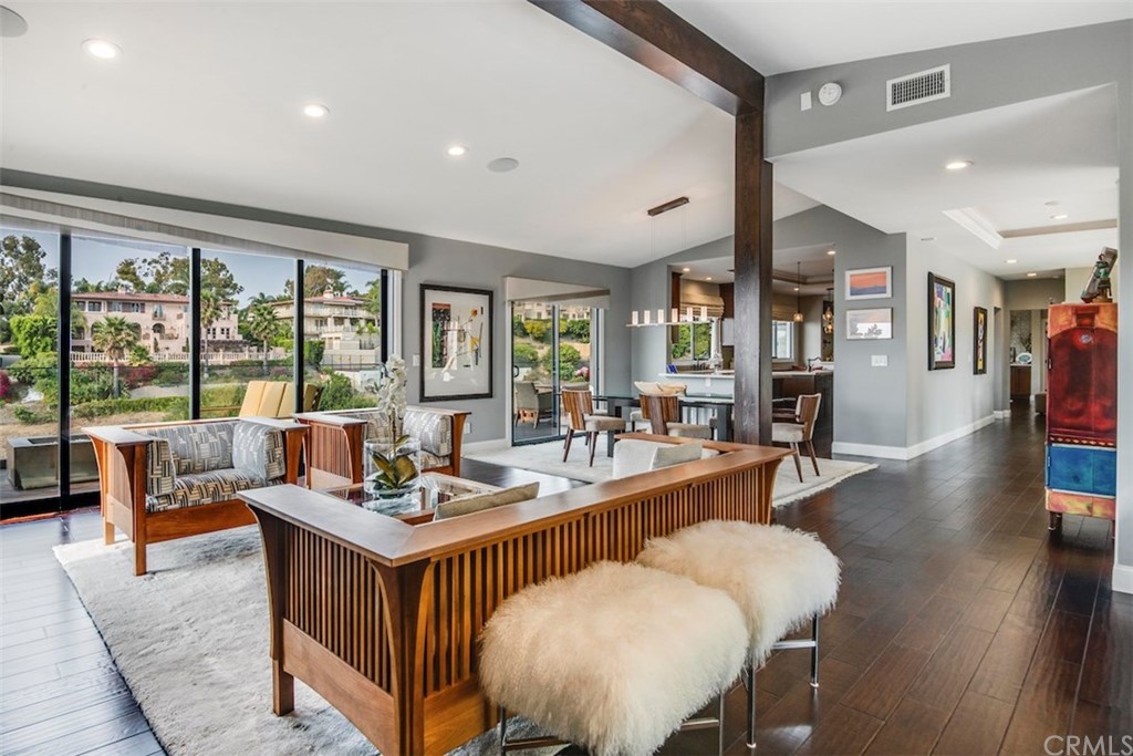 1539 Vía Coronel Palos Verdes Estates, CA 90274 - Photo 15 of 52 a dining room with wooden floor and large windows