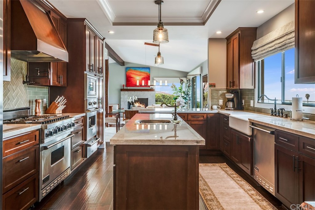 1539 Vía Coronel Palos Verdes Estates, CA 90274 - Photo 19 of 52 a kitchen with stainless steel appliances granite countertop a sink a stove and a refrigerator