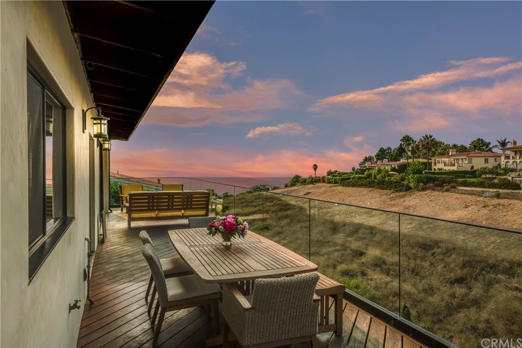 1539 Vía Coronel Palos Verdes Estates, CA 90274 - Photo 26 of 52 a view of a balcony with table and chairs and wooden floor