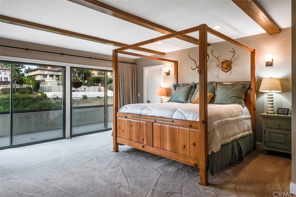 1539 Vía Coronel Palos Verdes Estates, CA 90274 - Photo 32 of 52 a bedroom with a bed and large glass window