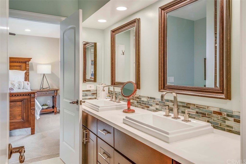1539 Vía Coronel Palos Verdes Estates, CA 90274 - Photo 39 of 52 a bathroom with double vanity sinks a mirror and a vanity