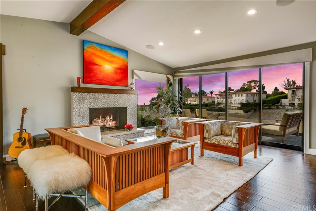 1539 Vía Coronel Palos Verdes Estates, CA 90274 - Photo 4 of 52 a living room with furniture a fireplace and a flat screen tv