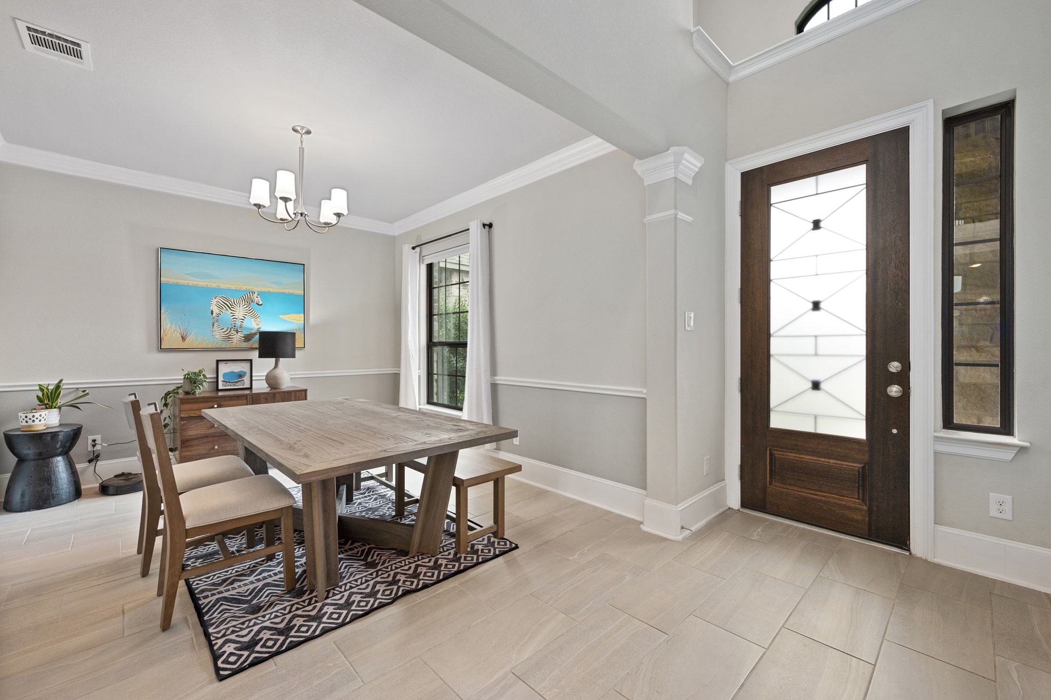 304 Wavy Cattail Cove Georgetown, TX 78626 - Photo 4 of 29 Dining area featuring crown molding and a chandelier