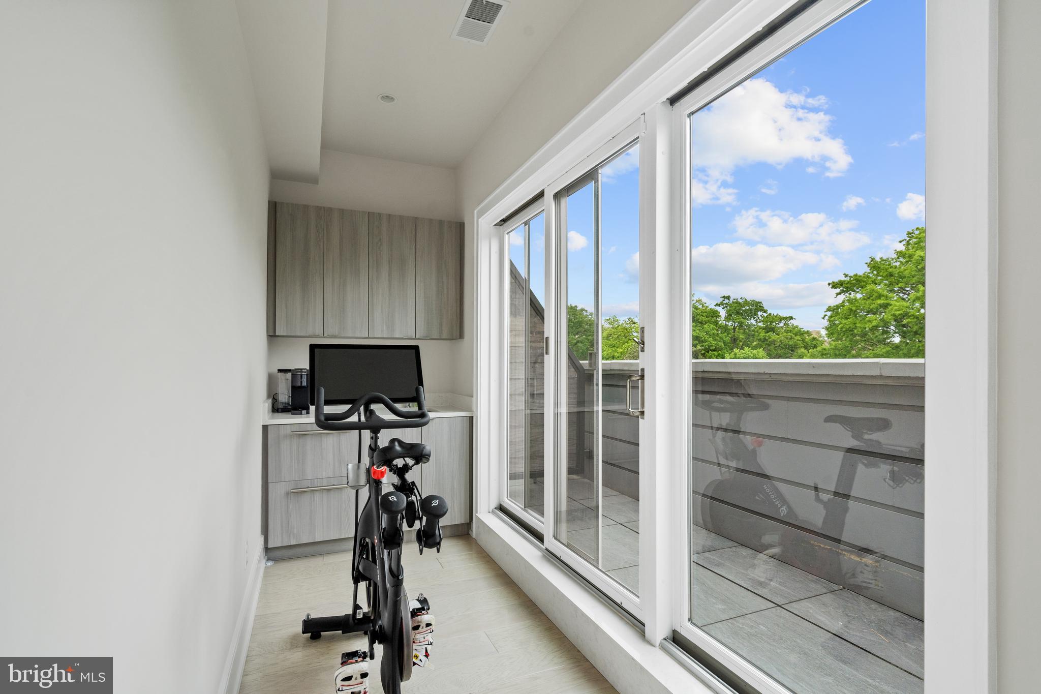 2434 16th Street Northwest, Unit PH402 Washington, DC 20009 - Photo 36 of 44 Loft/Exercise Area and Wet Bar/w Rooftop View