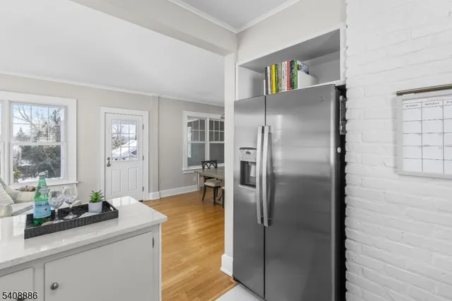a kitchen with refrigerator and window