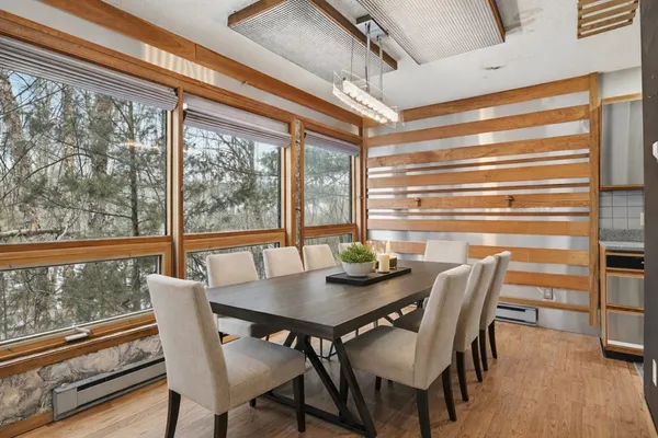 a view of a dining room with furniture window and wooden floor