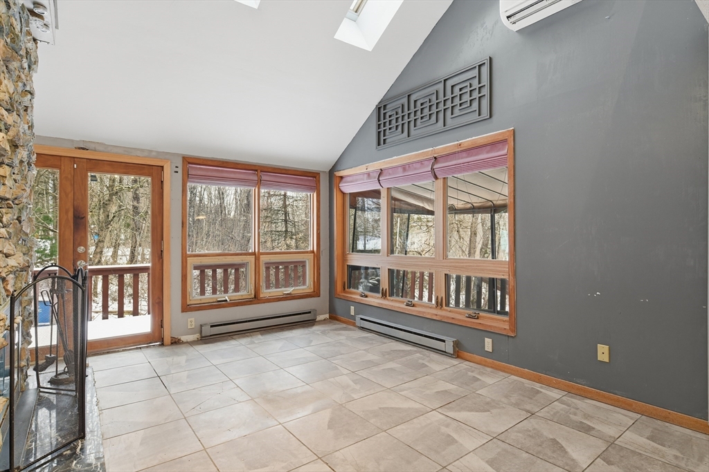 190 Dunhamtown Palmer Road Brimfield, MA 01010 - Photo 16 of 42 a view of an empty room with a window