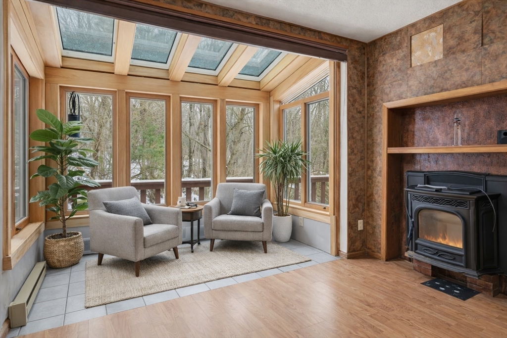 190 Dunhamtown Palmer Road Brimfield, MA 01010 - Photo 19 of 42 a living room with furniture and a fireplace