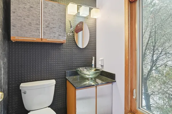 a bathroom with a toilet and a sink