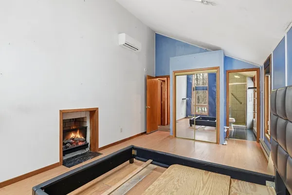 a bedroom with a bed and a night stand