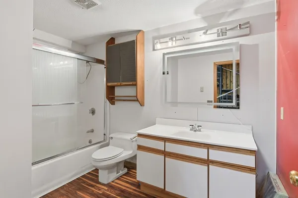 a view of patio with table and chairs under an umbrella