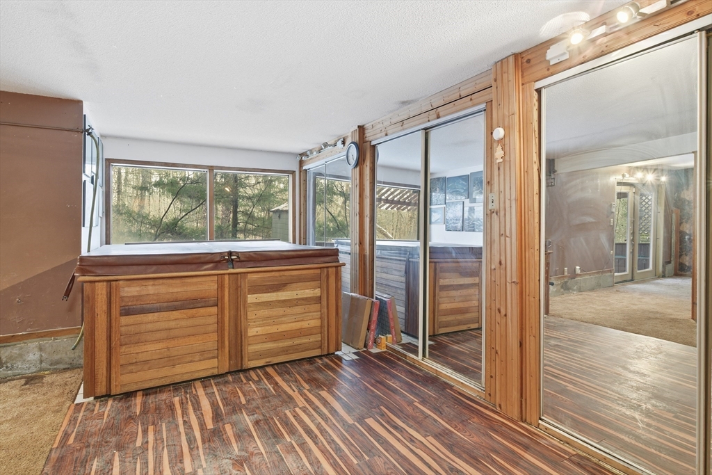 190 Dunhamtown Palmer Road Brimfield, MA 01010 - Photo 31 of 42 a view of walk in closet with wooden floor and balcony