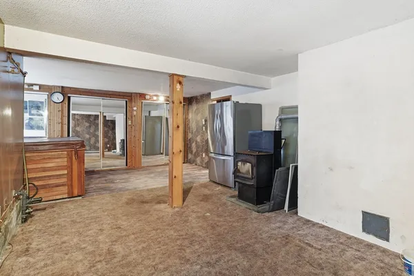 a view of balcony with a large window and wooden floor