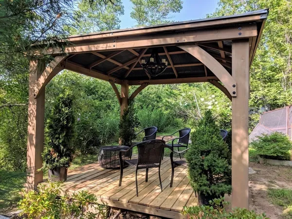 a view of balcony with wooden floor and fence