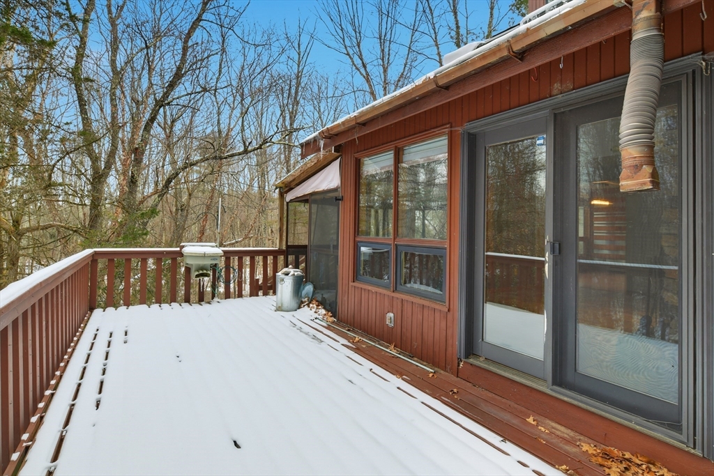 190 Dunhamtown Palmer Road Brimfield, MA 01010 - Photo 37 of 42 a view of balcony with a large window and wooden floor