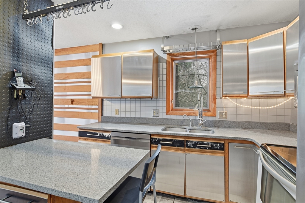 190 Dunhamtown Palmer Road Brimfield, MA 01010 - Photo 7 of 42 a kitchen with stainless steel appliances a sink a stove and a refrigerator