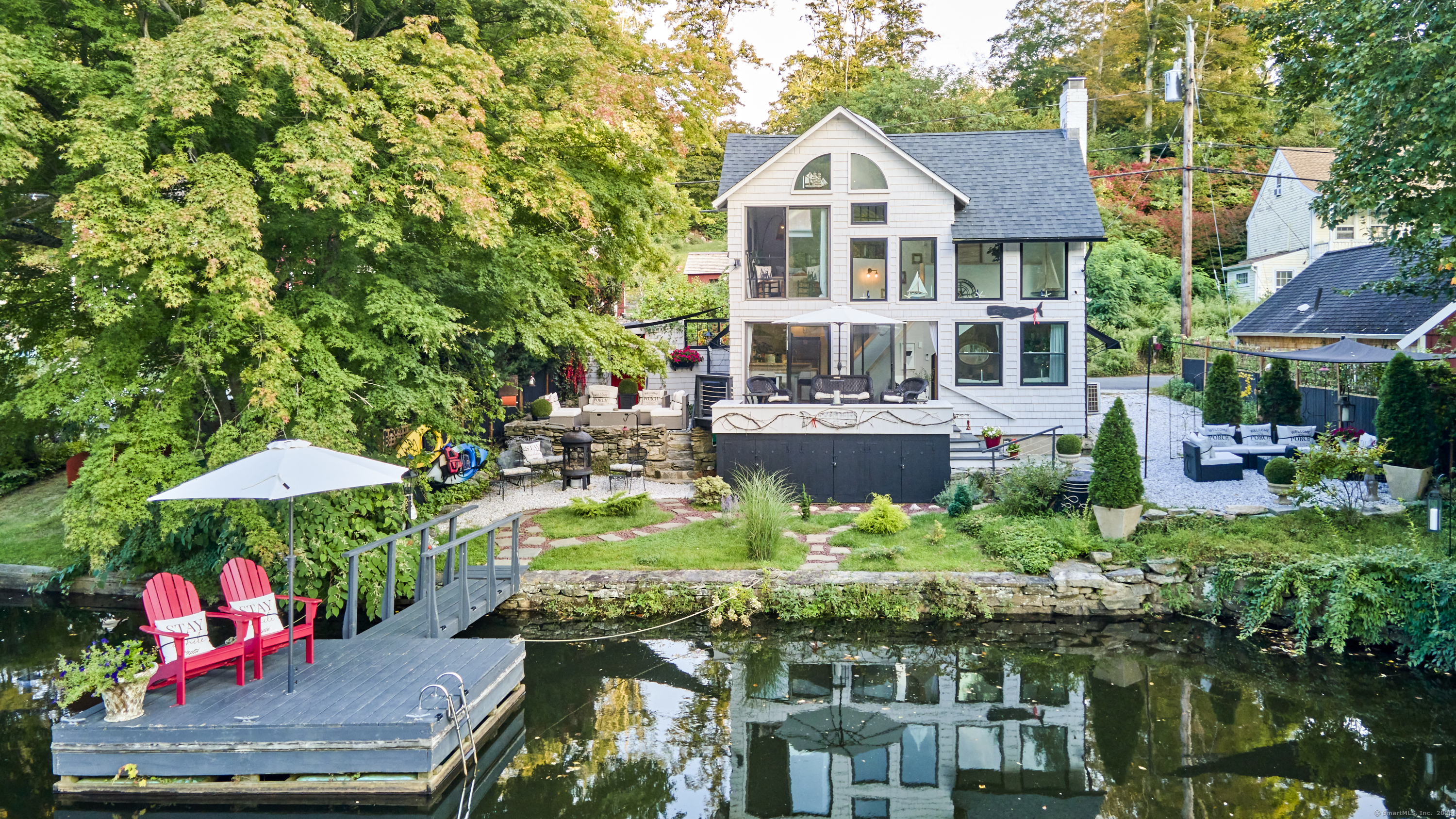 a view of a house with a yard and plants