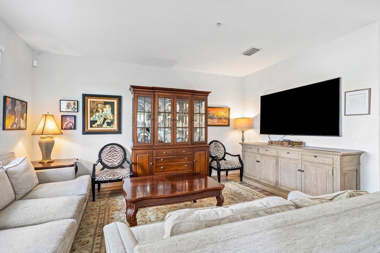 3659 Northwest 5th Terrace Boca Raton, FL 33431 - Photo 20 of 36 a living room with furniture and a flat screen tv
