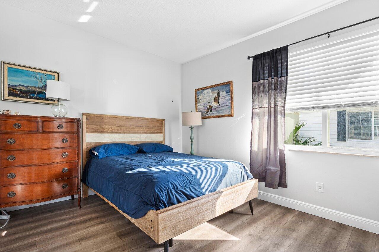 3659 Northwest 5th Terrace Boca Raton, FL 33431 - Photo 23 of 36 a bedroom with a bed and a window