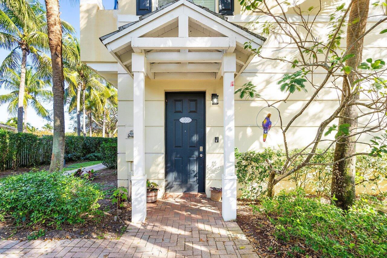 3659 Northwest 5th Terrace Boca Raton, FL 33431 - Photo 5 of 36 a front view of a house with garden