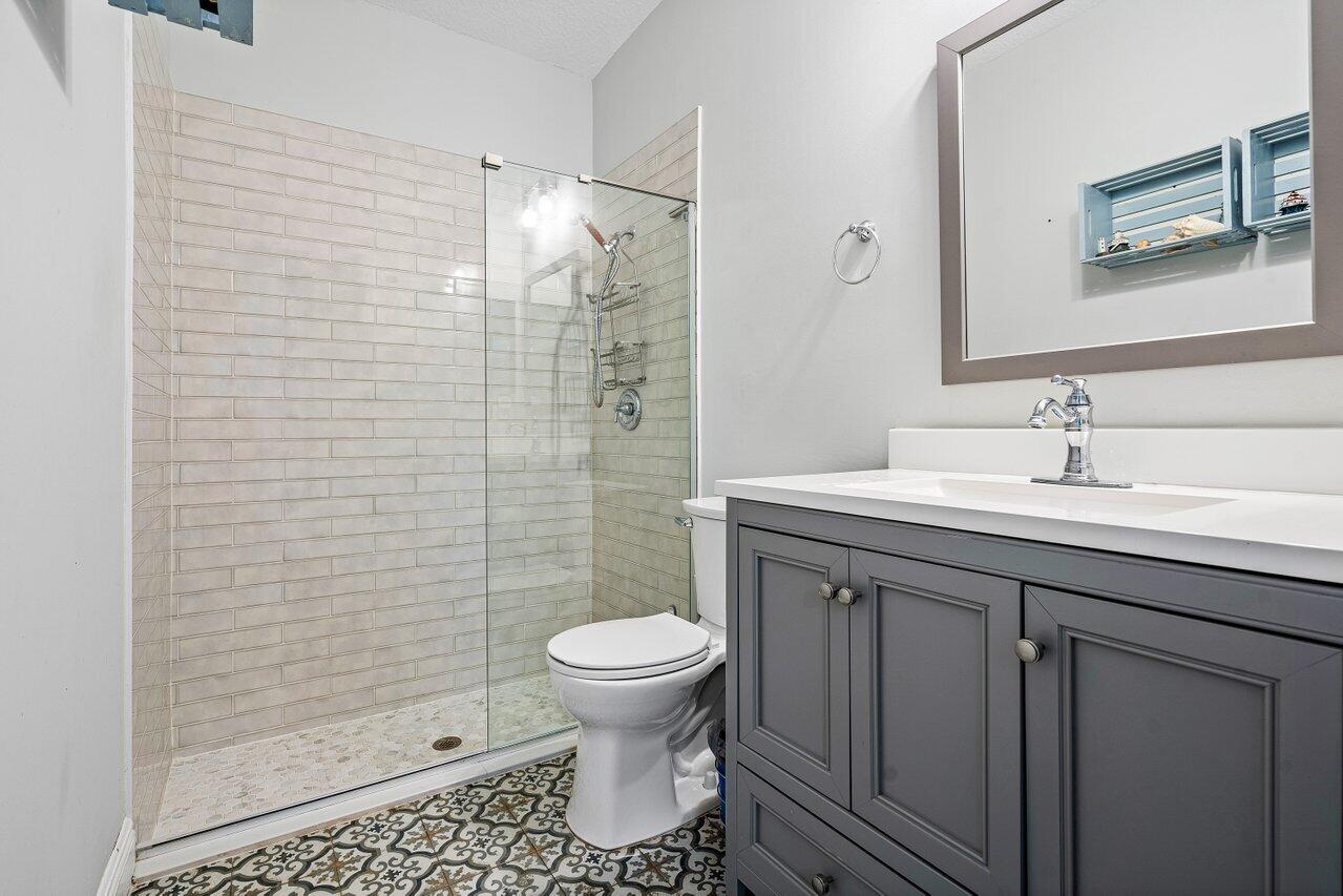 3659 Northwest 5th Terrace Boca Raton, FL 33431 - Photo 8 of 36 a bathroom with a sink toilet and shower