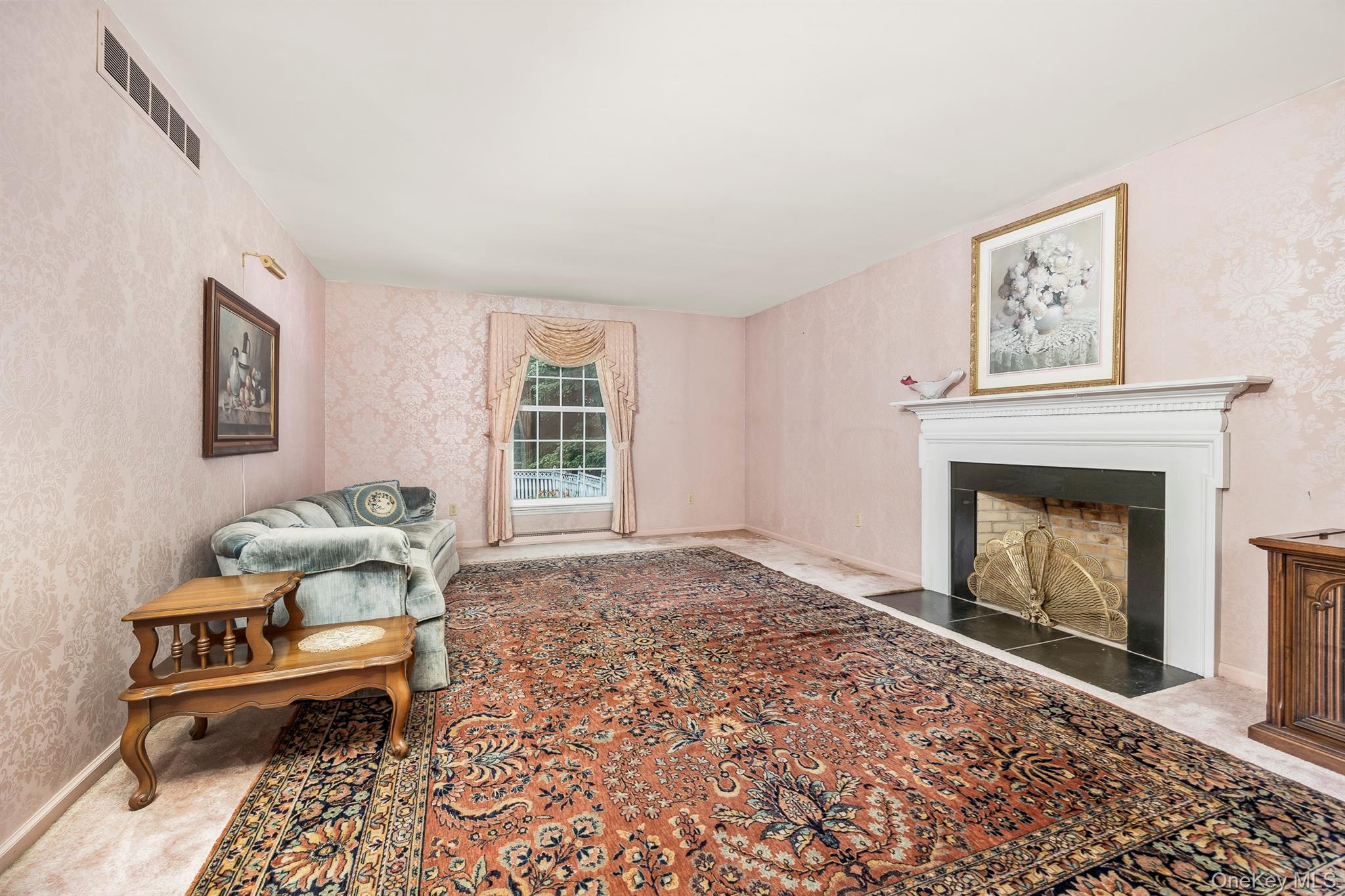 75 Hornbeck Road Poughkeepsie, NY 12603 - Photo 11 of 36 a living room with furniture and a fireplace