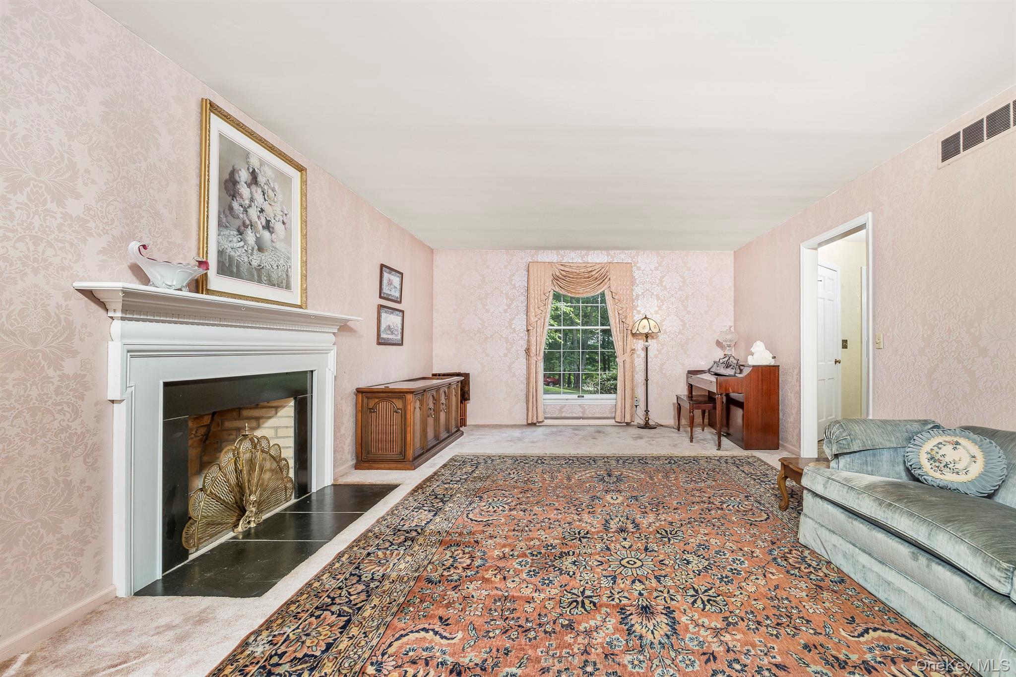 75 Hornbeck Road Poughkeepsie, NY 12603 - Photo 12 of 36 a living room with furniture and a fireplace
