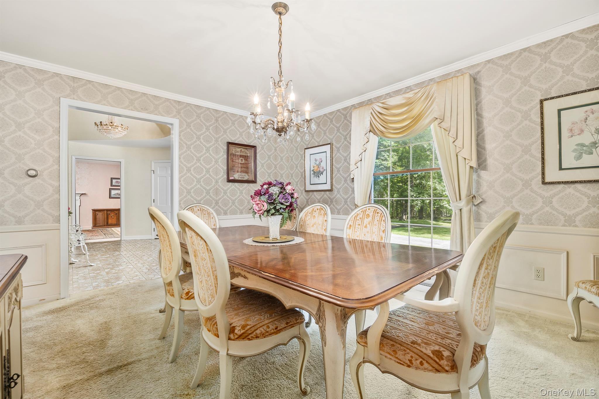 75 Hornbeck Road Poughkeepsie, NY 12603 - Photo 14 of 36 a dining room with furniture a chandelier and wooden floor