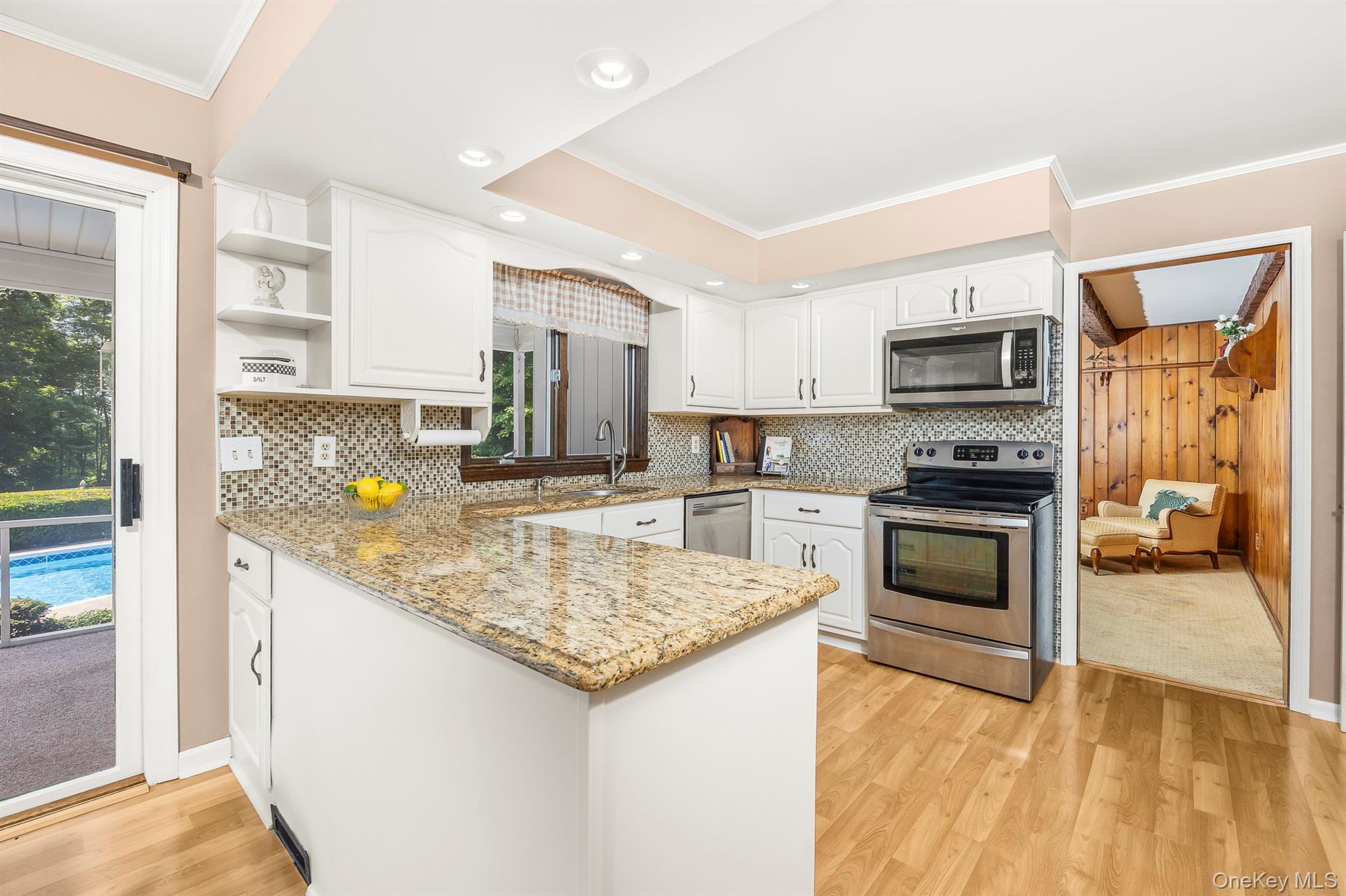 75 Hornbeck Road Poughkeepsie, NY 12603 - Photo 15 of 36 a kitchen with stainless steel appliances granite countertop a sink stove microwave and refrigerator