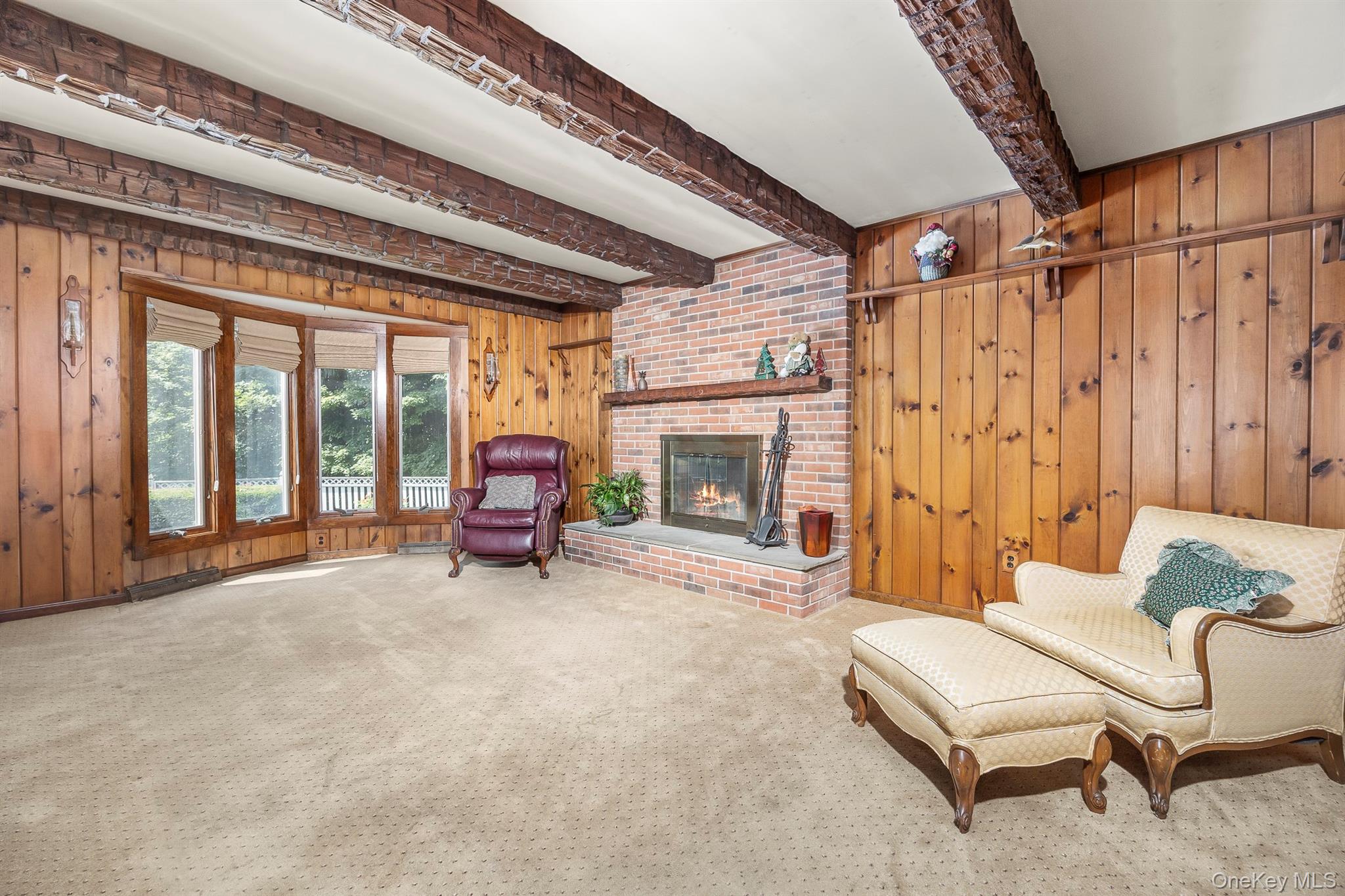 75 Hornbeck Road Poughkeepsie, NY 12603 - Photo 20 of 36 a living room with furniture and a fireplace