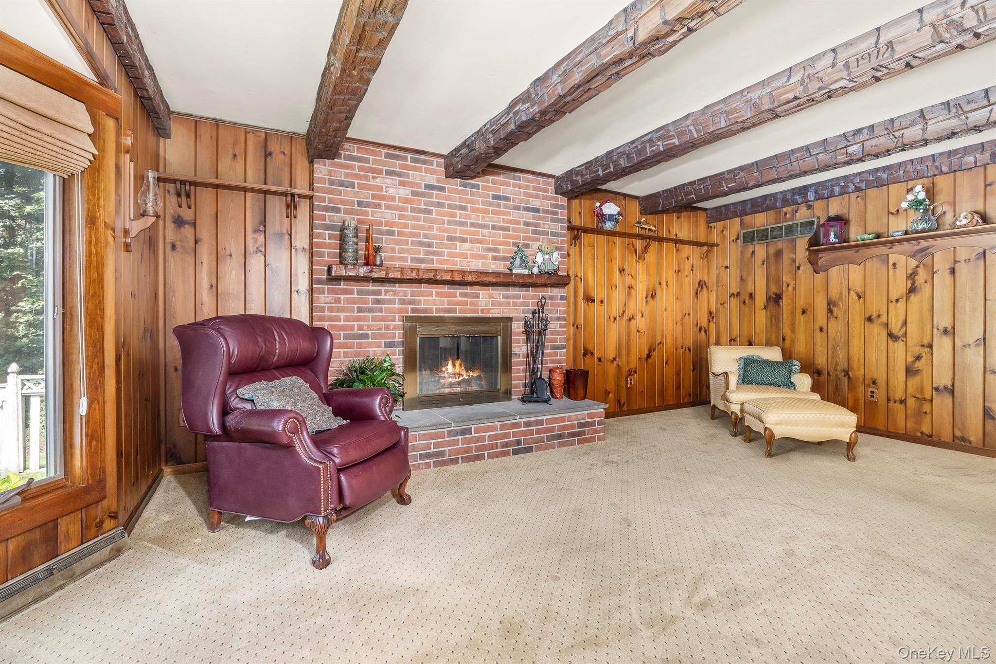 75 Hornbeck Road Poughkeepsie, NY 12603 - Photo 21 of 36 a living room with furniture and a fireplace