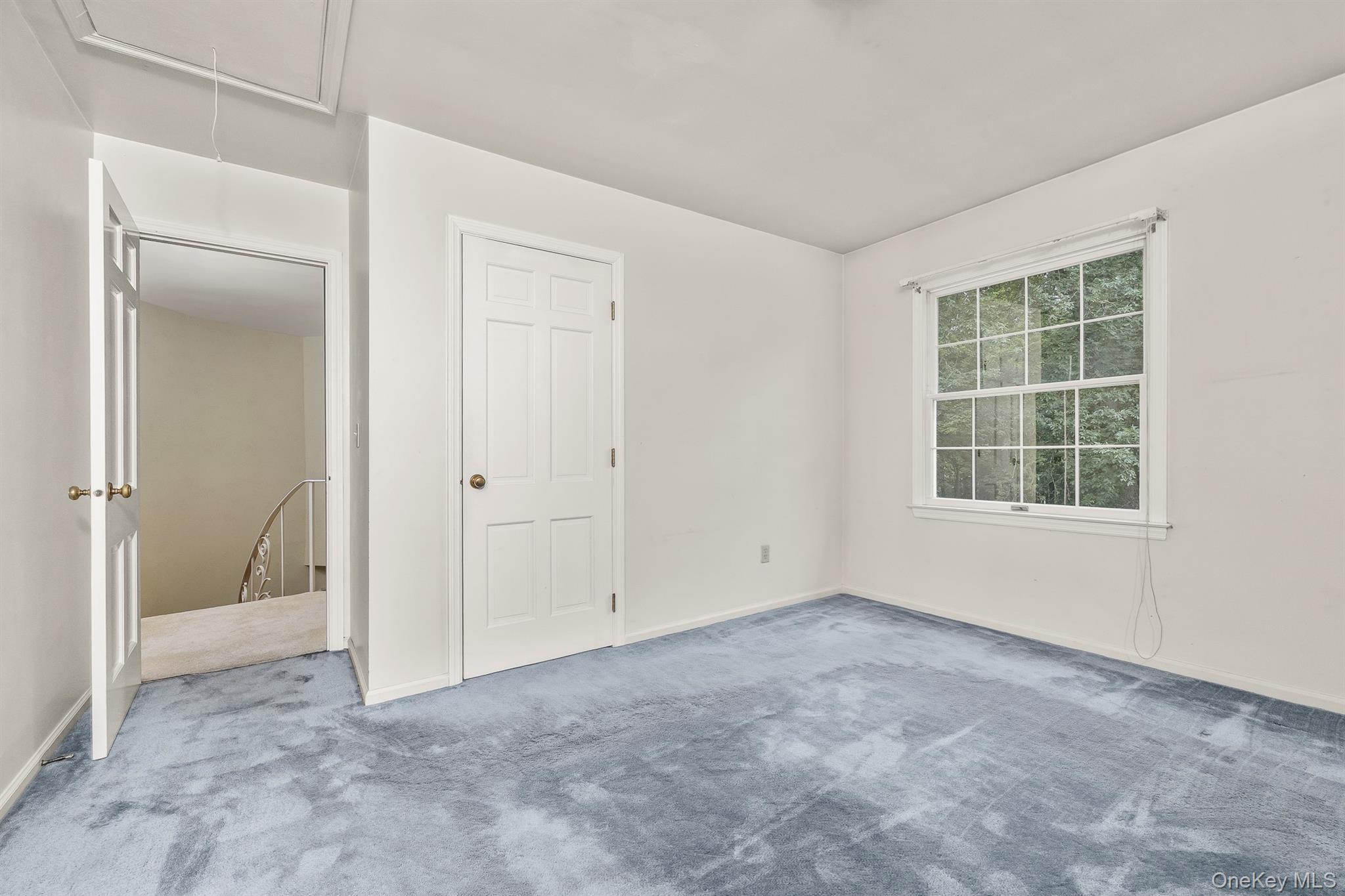 75 Hornbeck Road Poughkeepsie, NY 12603 - Photo 29 of 36 an empty room with windows and closet