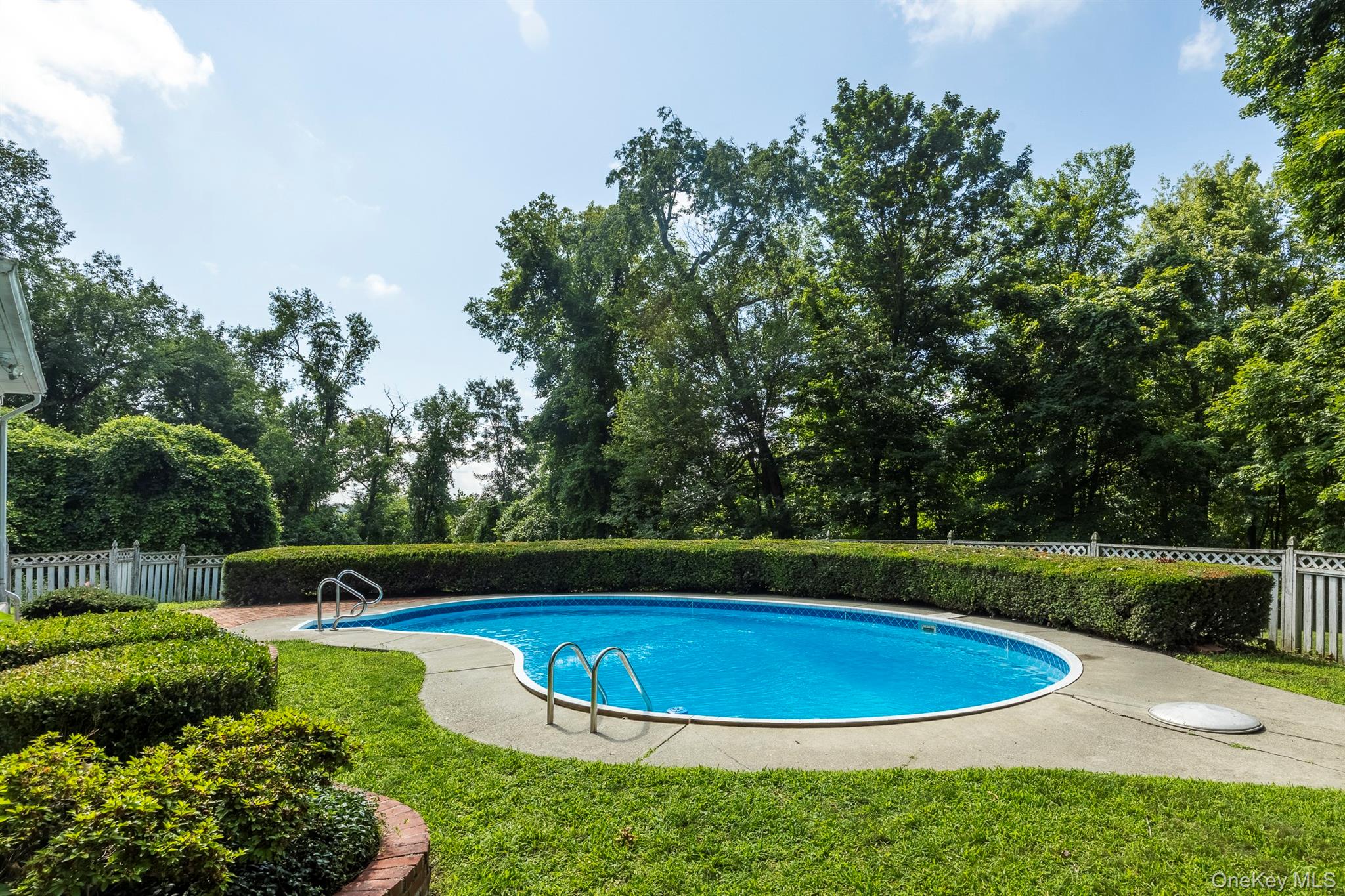 75 Hornbeck Road Poughkeepsie, NY 12603 - Photo 34 of 36 a view of a swimming pool with a garden