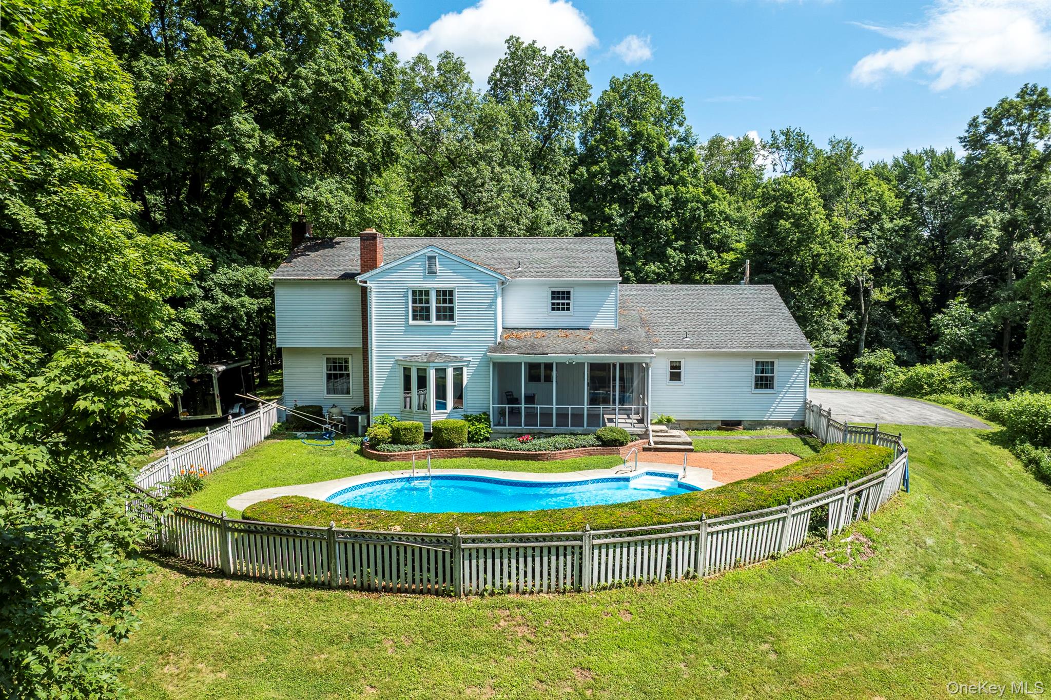 75 Hornbeck Road Poughkeepsie, NY 12603 - Photo 35 of 36 a table and chairs in front of the house