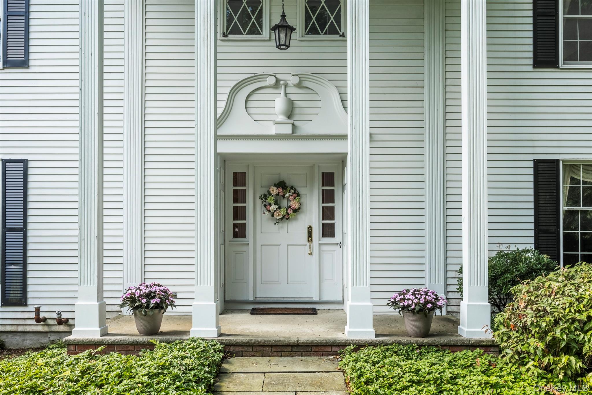 75 Hornbeck Road Poughkeepsie, NY 12603 - Photo 6 of 36 a front view of a house with a potted plant