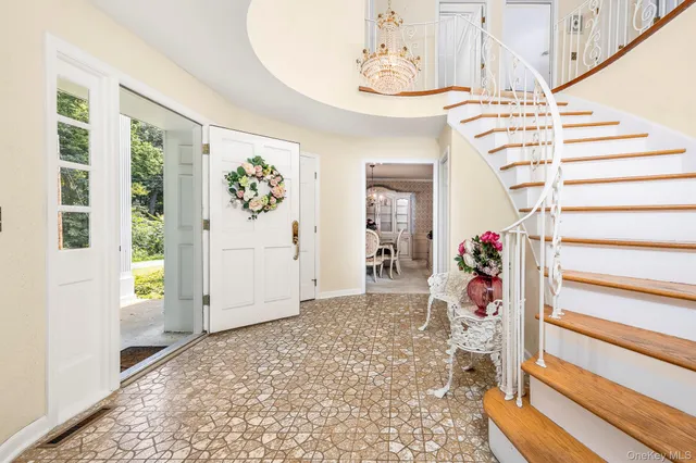a view of an entryway with wooden floor
