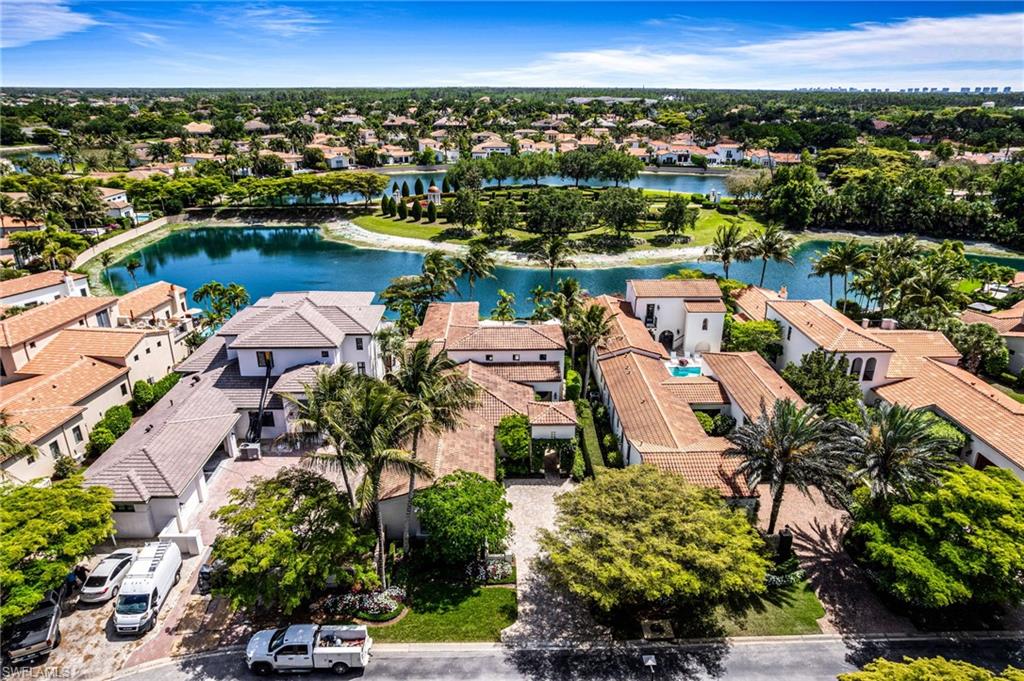 16755 Lucarno Way Naples, FL 34110 - Photo 1 of 50 an aerial view of a city with lots of residential buildings lake and ocean view