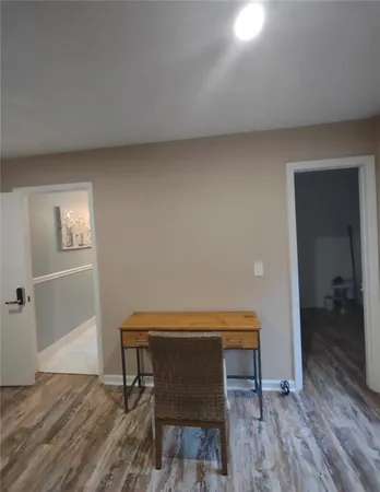 a room with furniture and wooden floor