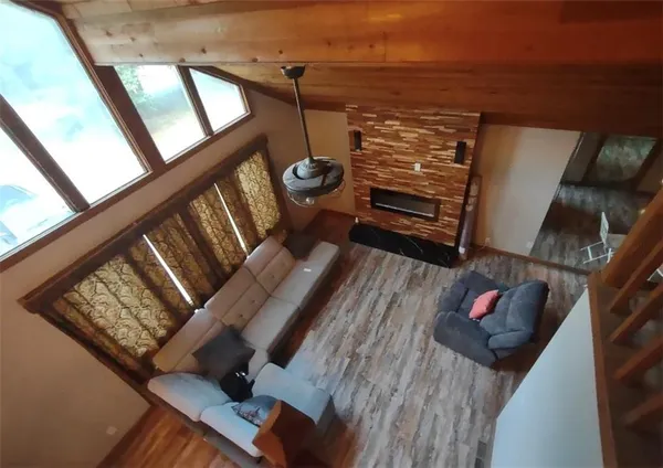 a view of an entryway with wooden floor
