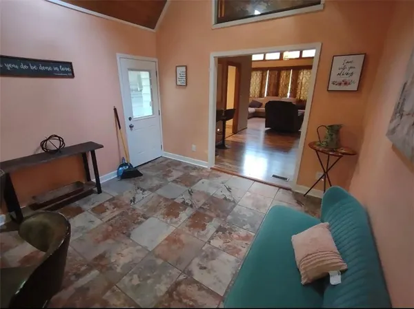 a view of living room with furniture and a flat screen tv