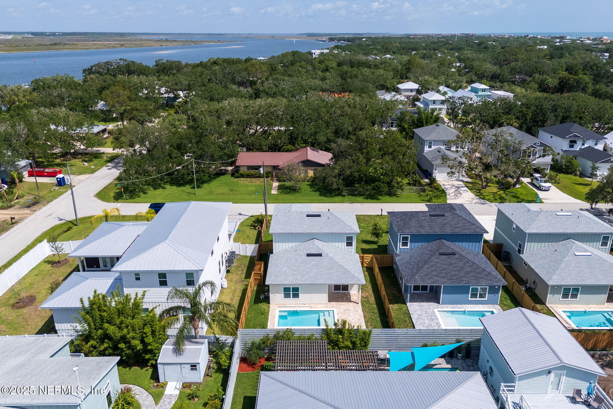 603-609 Twenty Second Street St. Augustine, FL 32084 - Photo 2 of 36 an aerial view of multiple houses with a yard