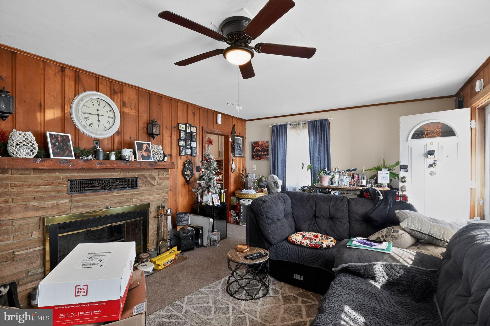 318 Newport Neck Road Newport, NJ 08345 - Photo 12 of 25 a living room with furniture and a fireplace